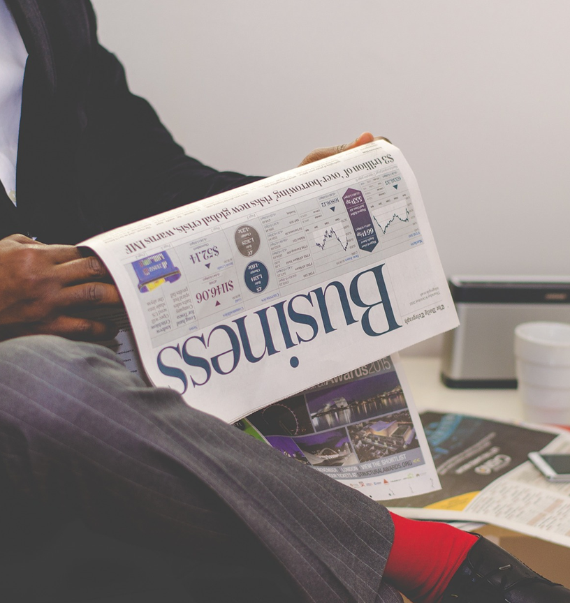 Guy reading a newspaper