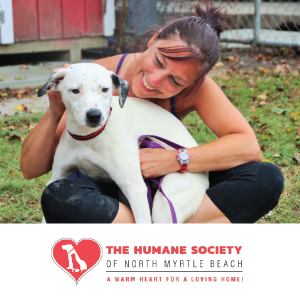 Advertisement featuring woman holding a dog for The Human Society of North Myrtle Beach